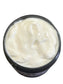 Jar of white moisturizing hair cream 